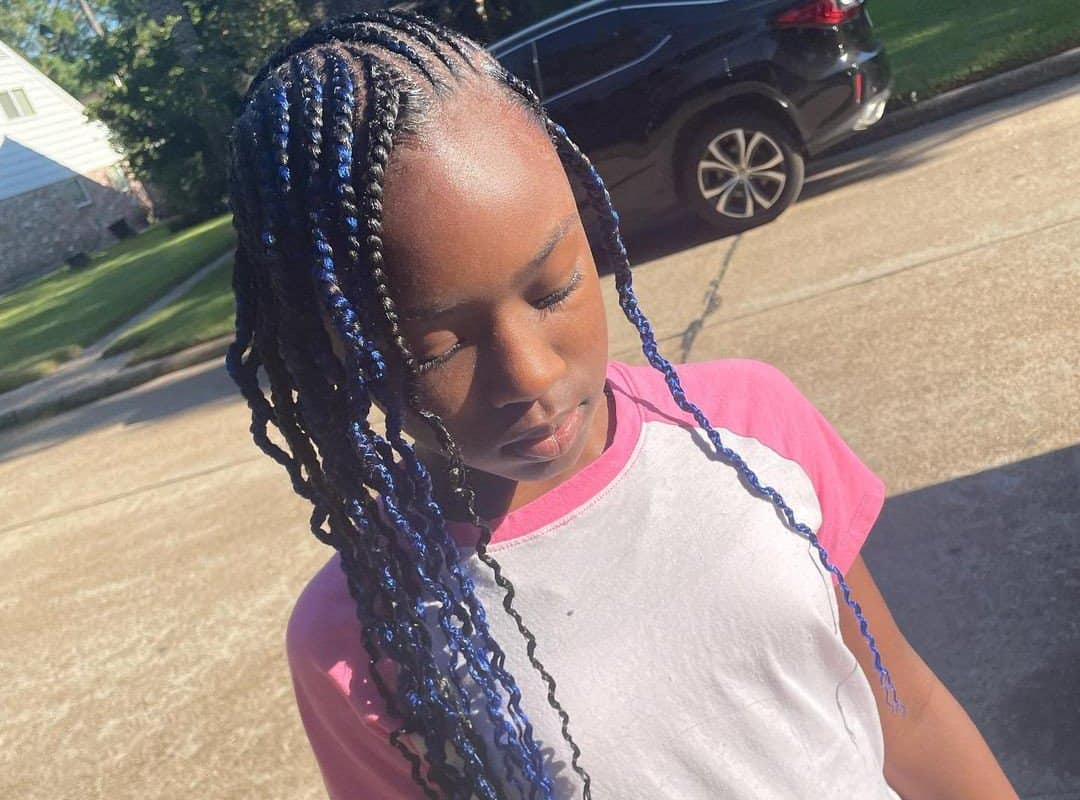 girl with black and dark blue tribal braids with beads and curls