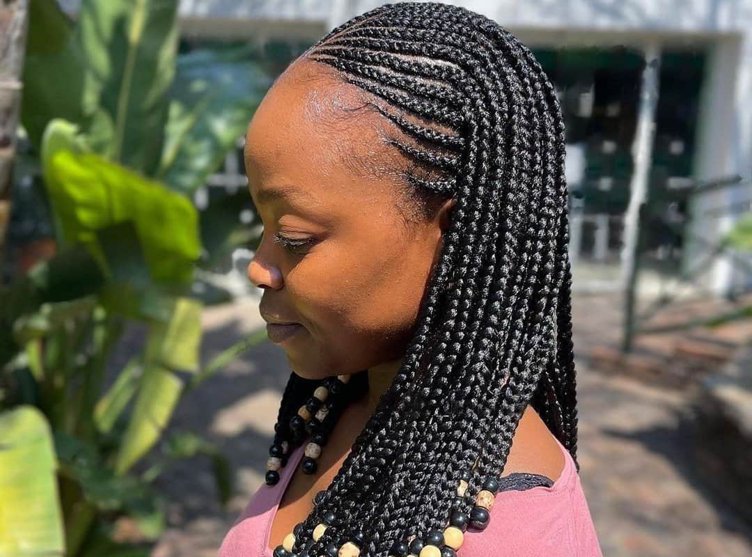 woman with black bob tribal braids with beads