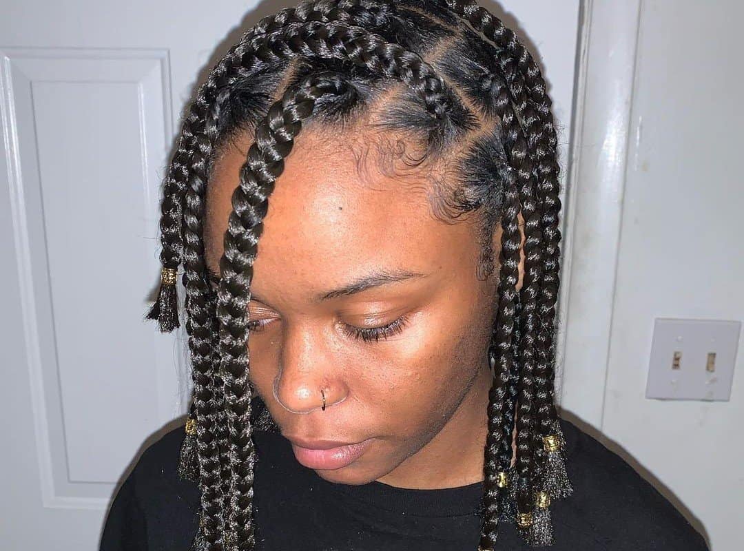 woman with black pixie tribal braids with beads