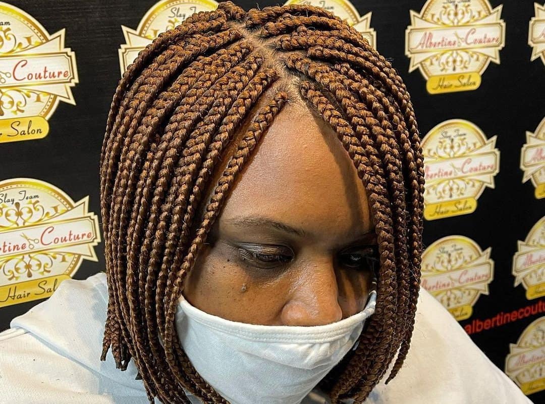 woman with brown pixie tribal braids