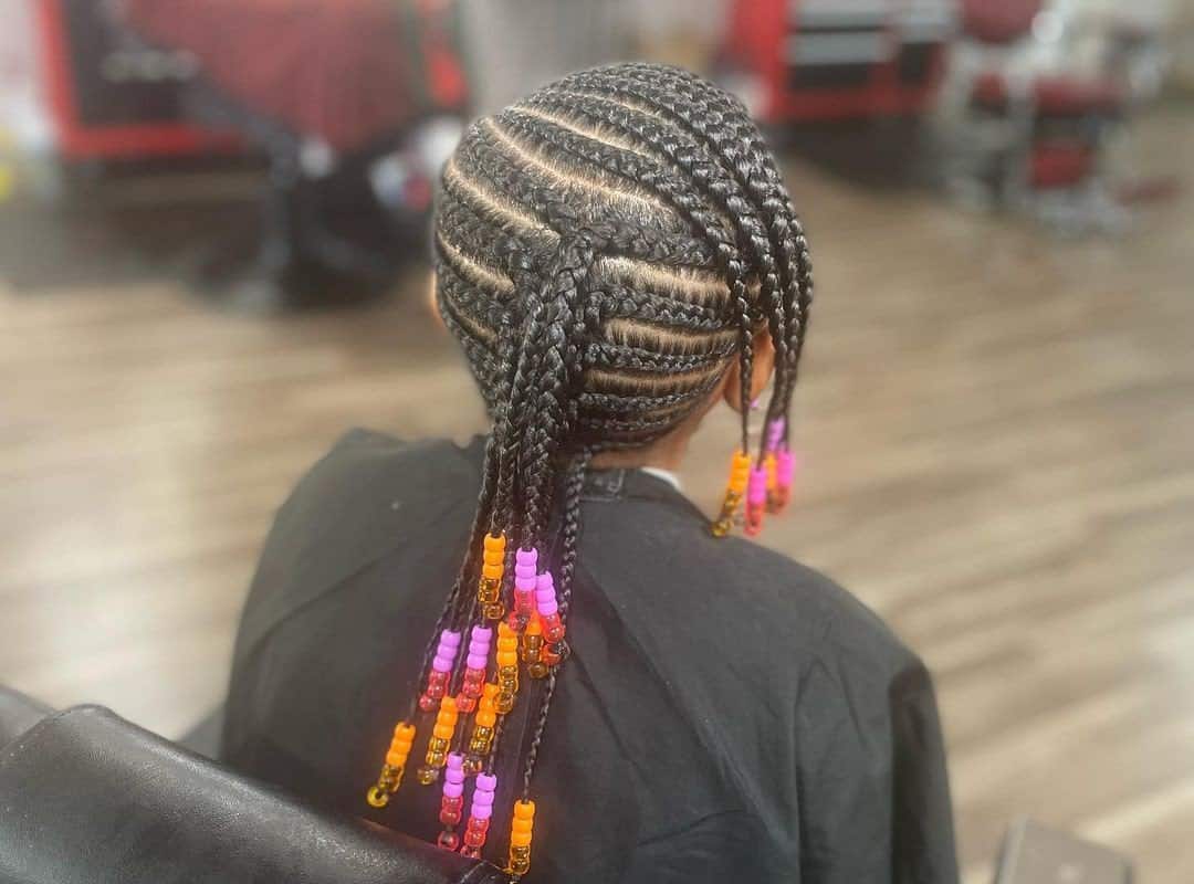 girl with brown tribal braids with colored beads