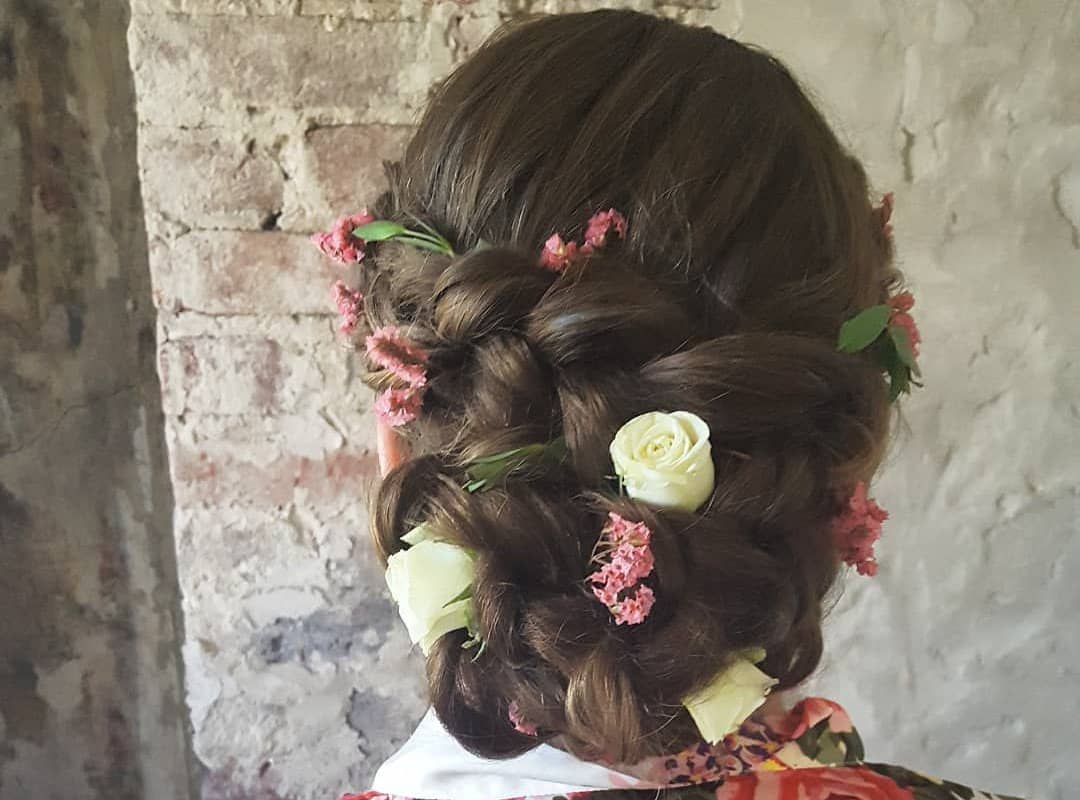 girl with brown tribal braids with flowers