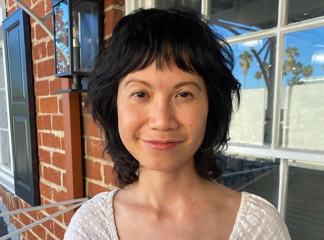 woman with short hair and baby bangs