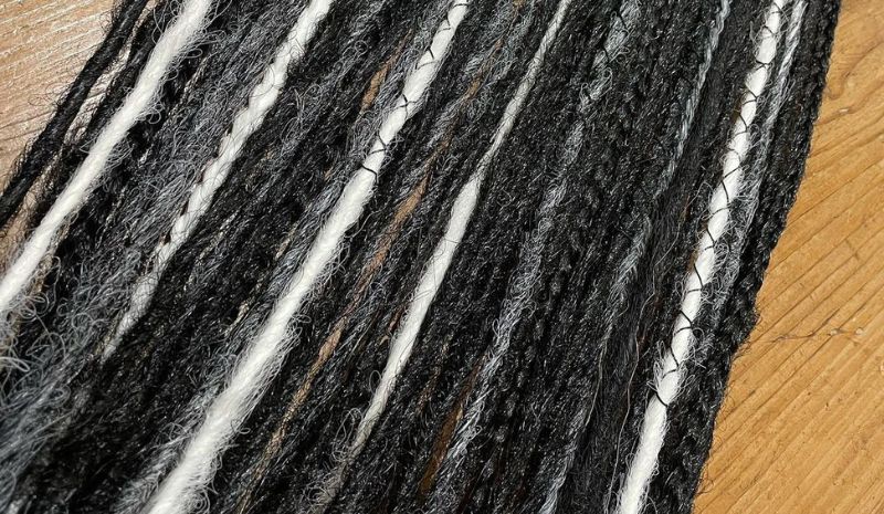 Black & grey dreads on the table