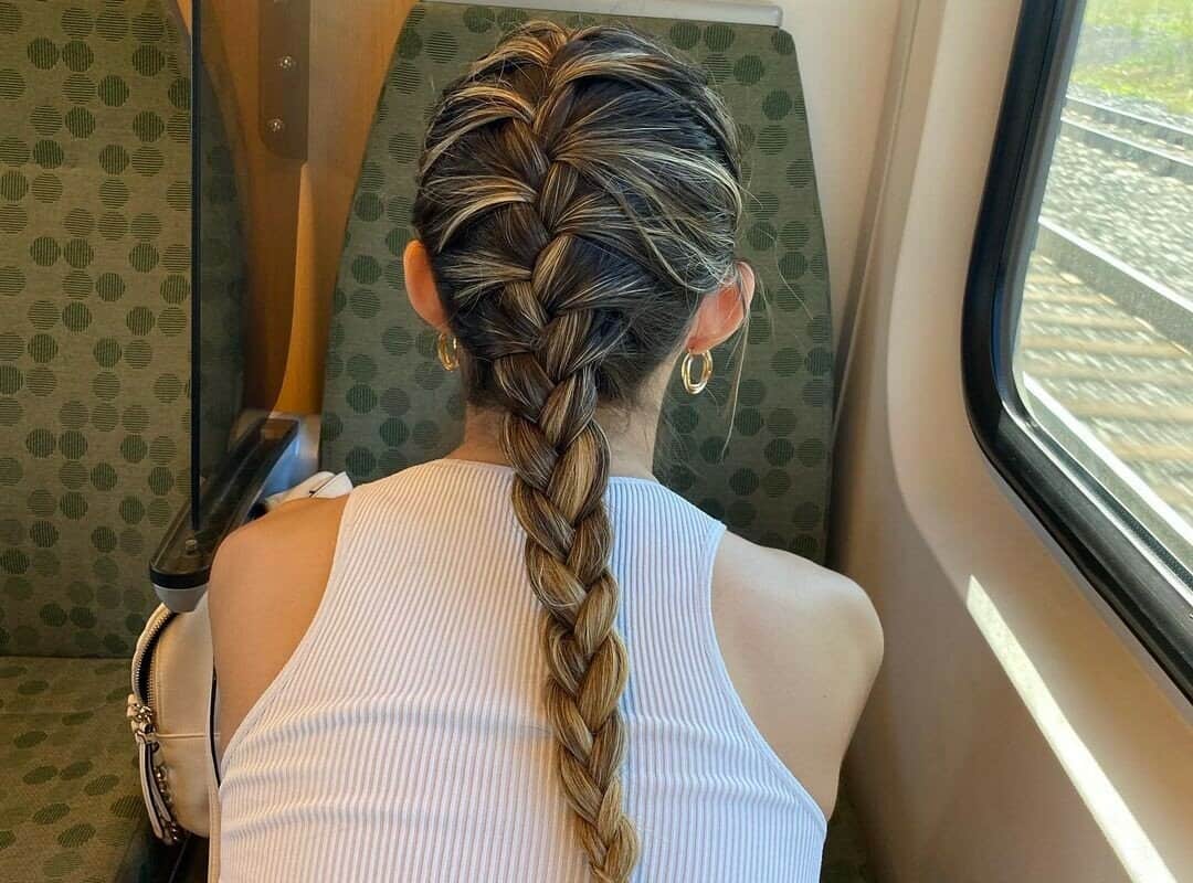 girl with a French braid in the train