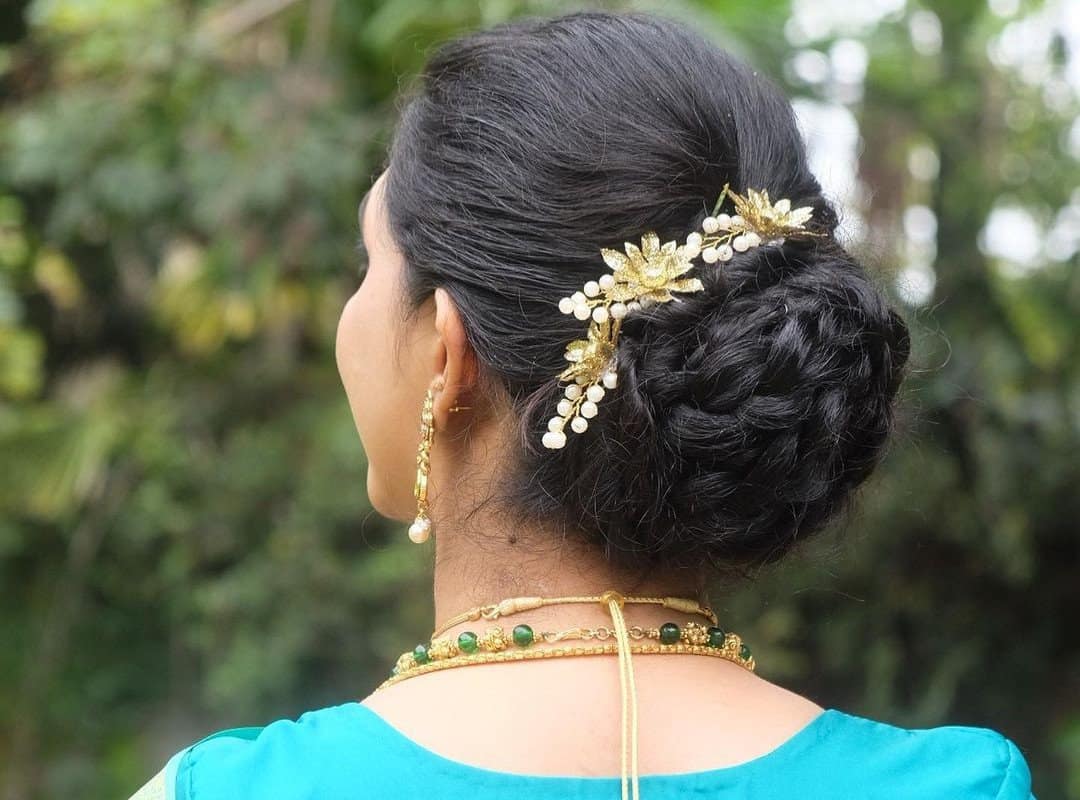 girl with a messy braided bun and flowers