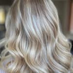 Ash blonde balayage with bangs