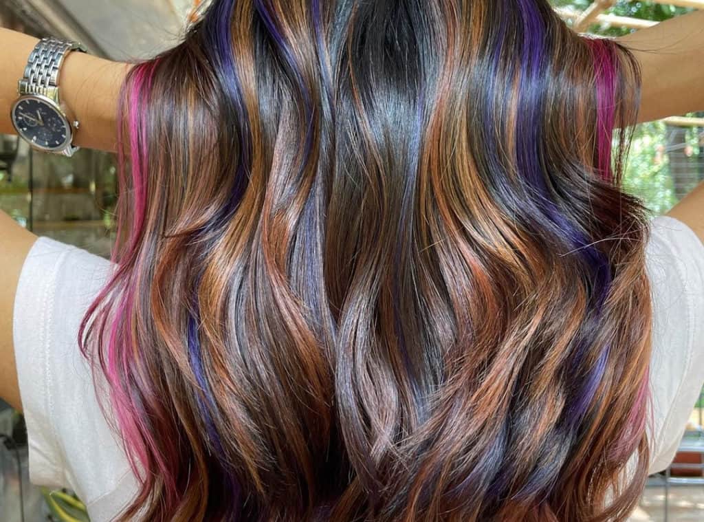 brown mermaid hair with pink, blue and green highlights