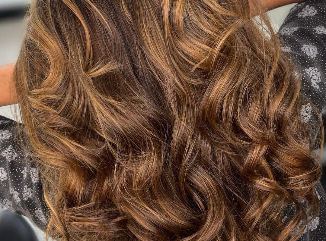 cinnamon balayage on swirl brown hair