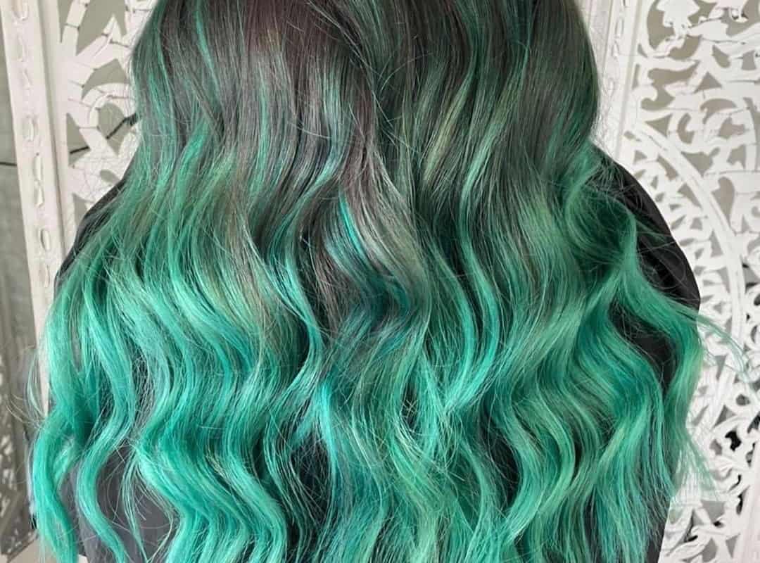 brown hair with soft mint green balayage