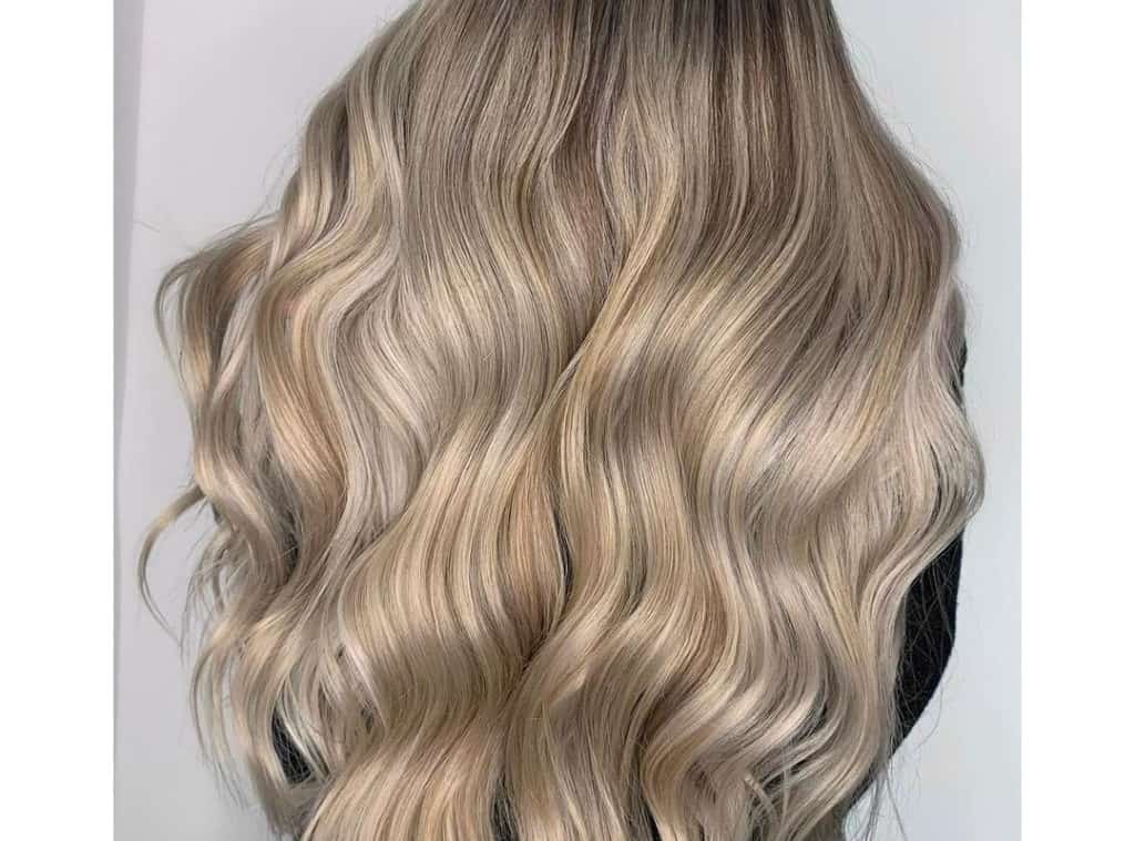 bright blonde balayage long waves