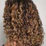 Honey balayage on curly dark brown hair