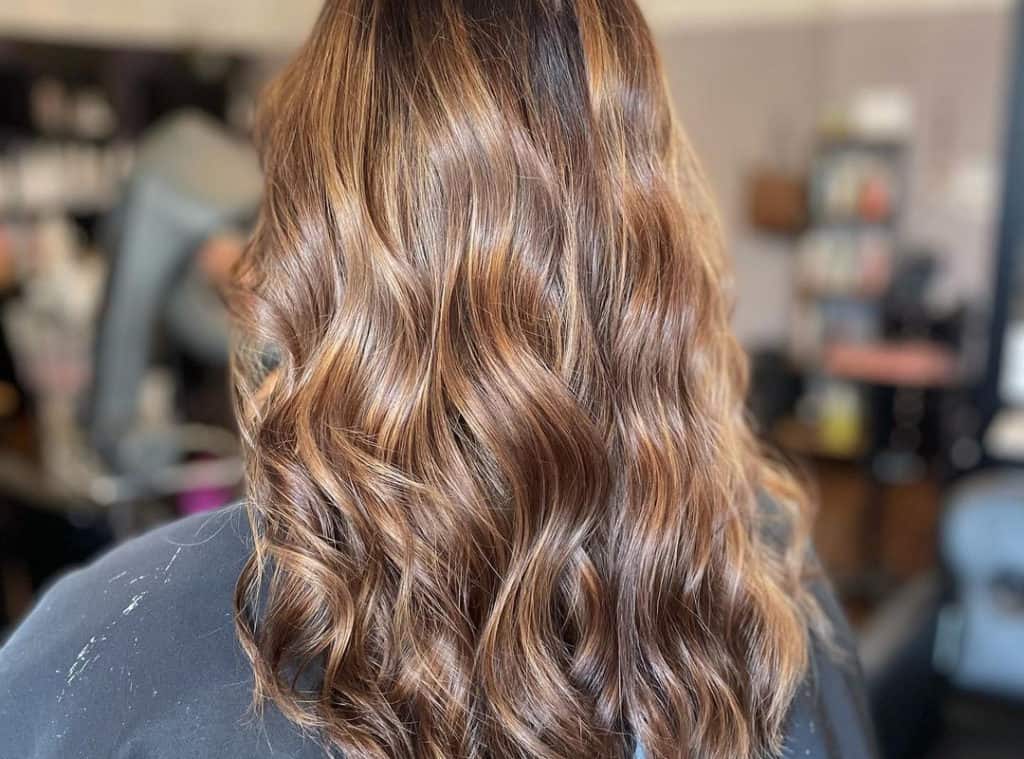 Butterscotch caramel balayage hairstyle with highlights