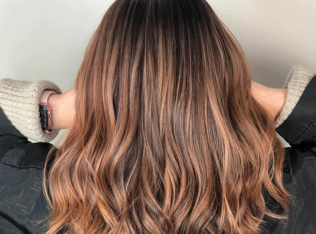 light copper balayage with dark brown roots