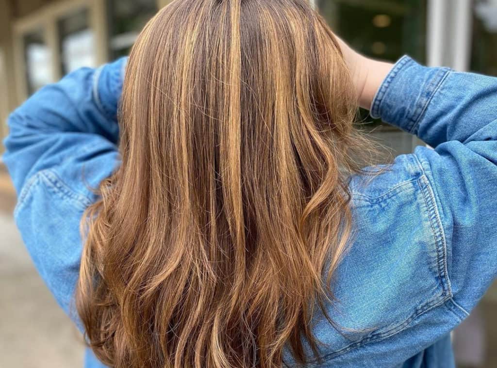Hair with Warm butterscotch caramel balayage