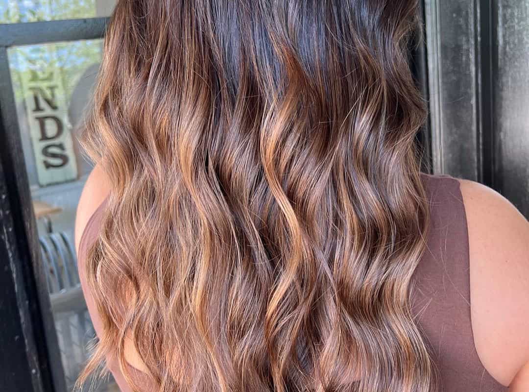 butterscotch caramel balayage with dark roots