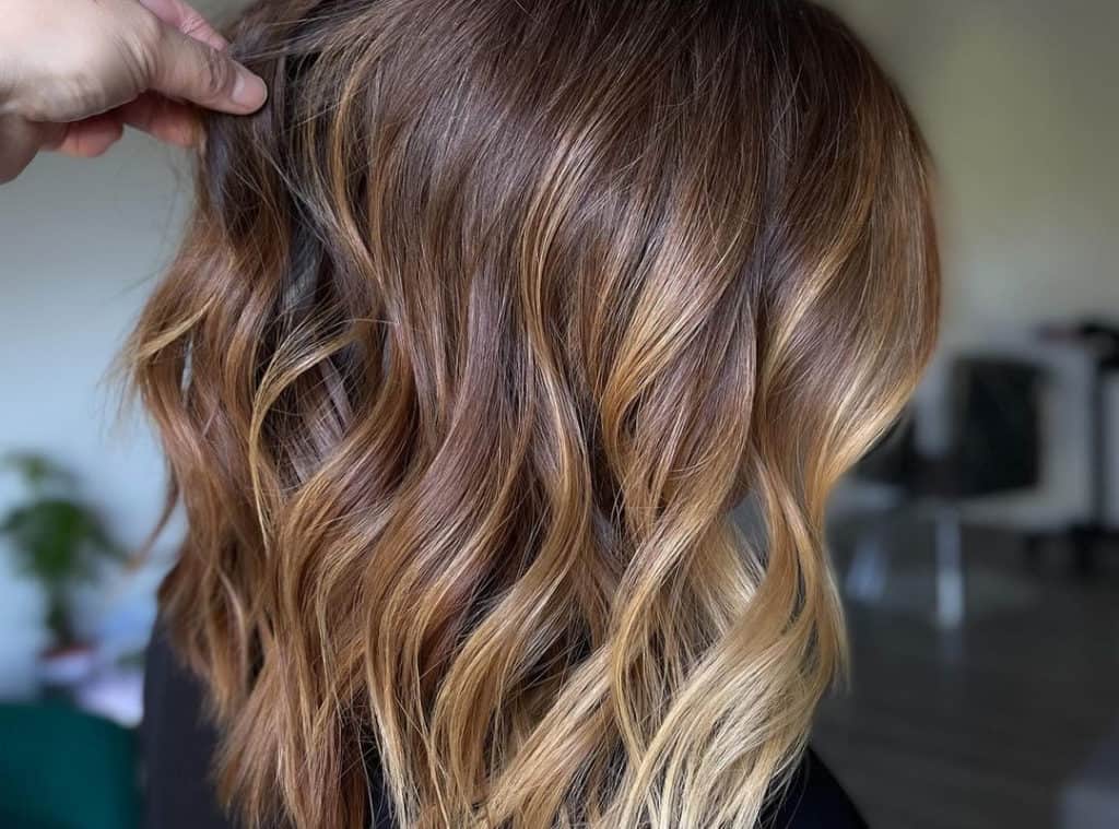 brown balayage bob with blonde tips