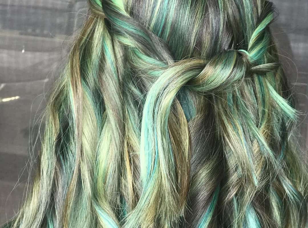Soft Mint Green Balayage with blonde and brown highlights