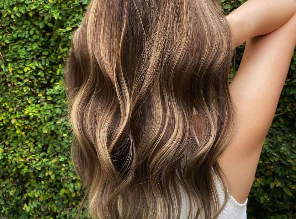 warm brown balayage with golden highlights