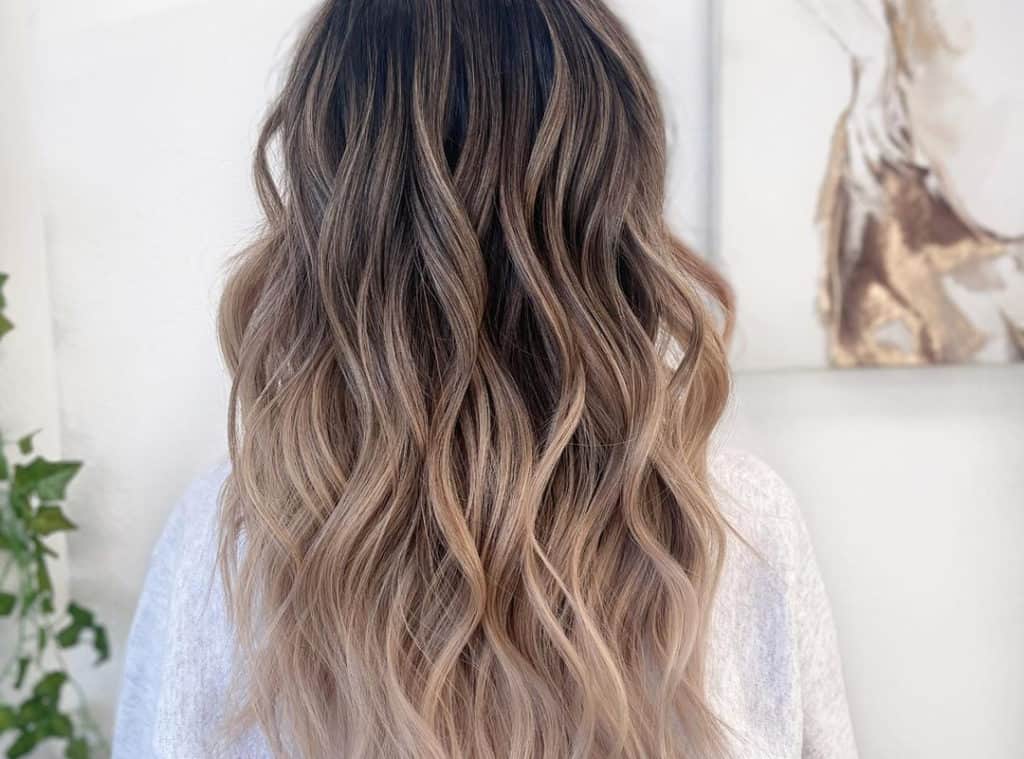 brown balayage with blonde tips on long hair