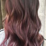 brown balayage with strawberry highlights