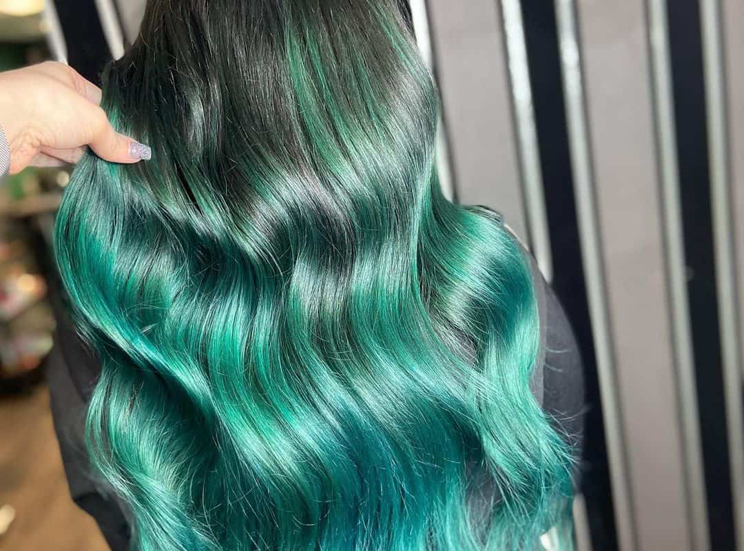 green balayage with dark roots and silver highlights
