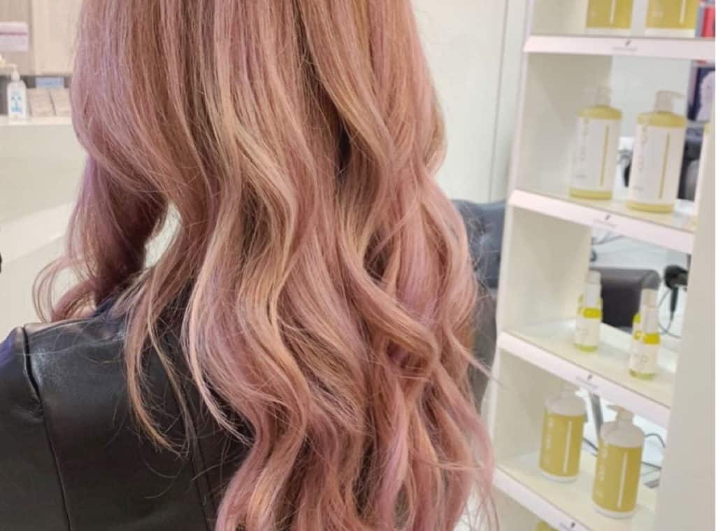 blonde balayage with strawberry highlights