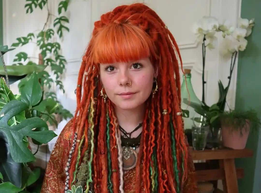 woman with red hippie dreads with jewelry