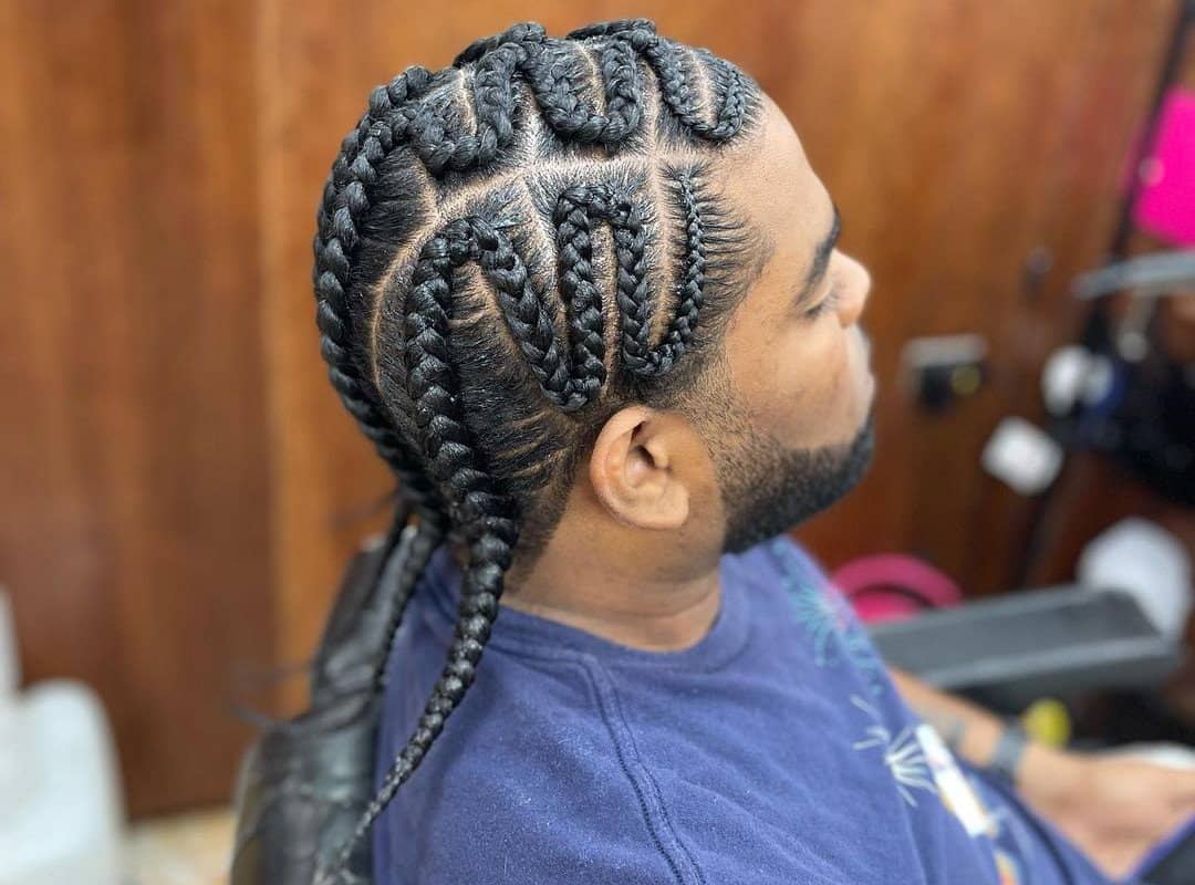 man with brown men box zig-zag braids