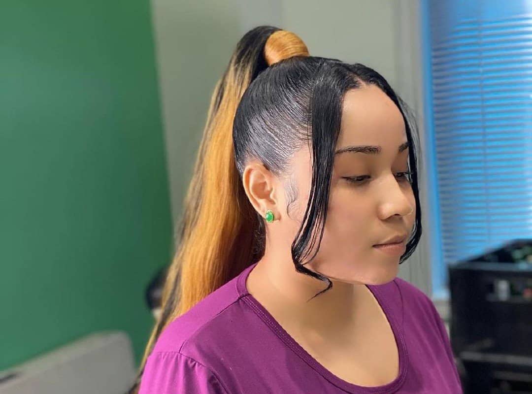 girl with black and blonde high ponytail