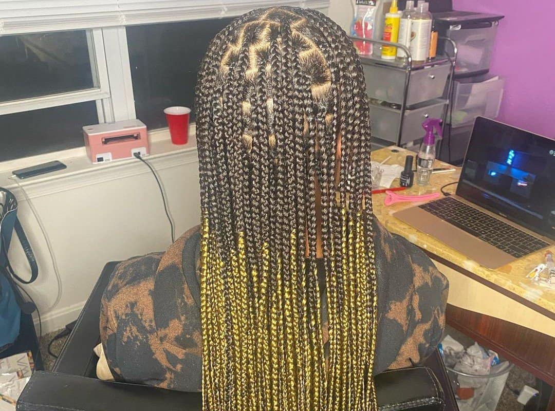 girl with black and yellow ombre knotless braids