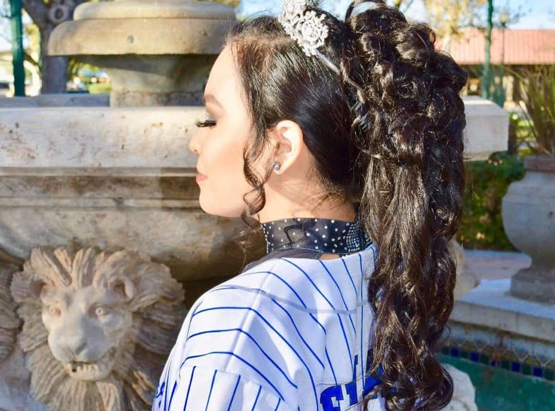 girl with a brown cheer curls ponytail