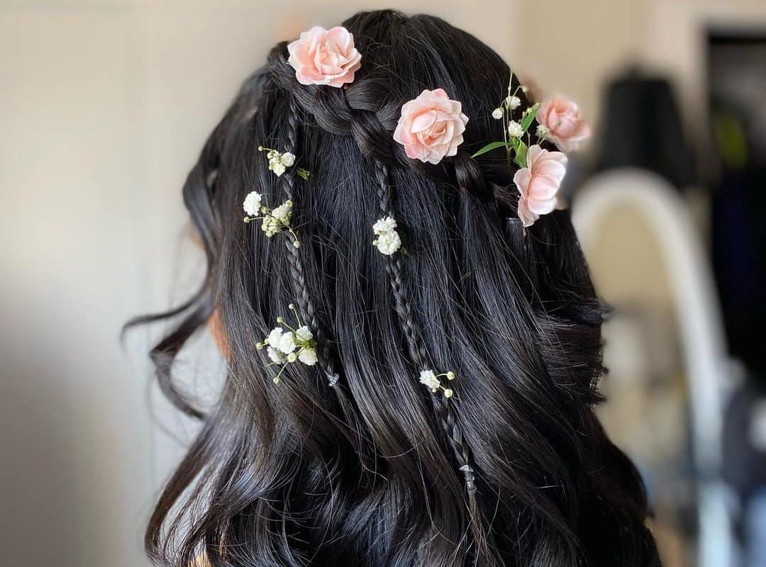 girl with black half up, half down with flowers