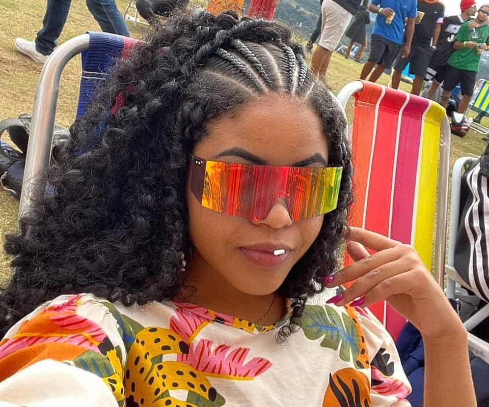girl with black thai braids half-up, half-down and sunglasses