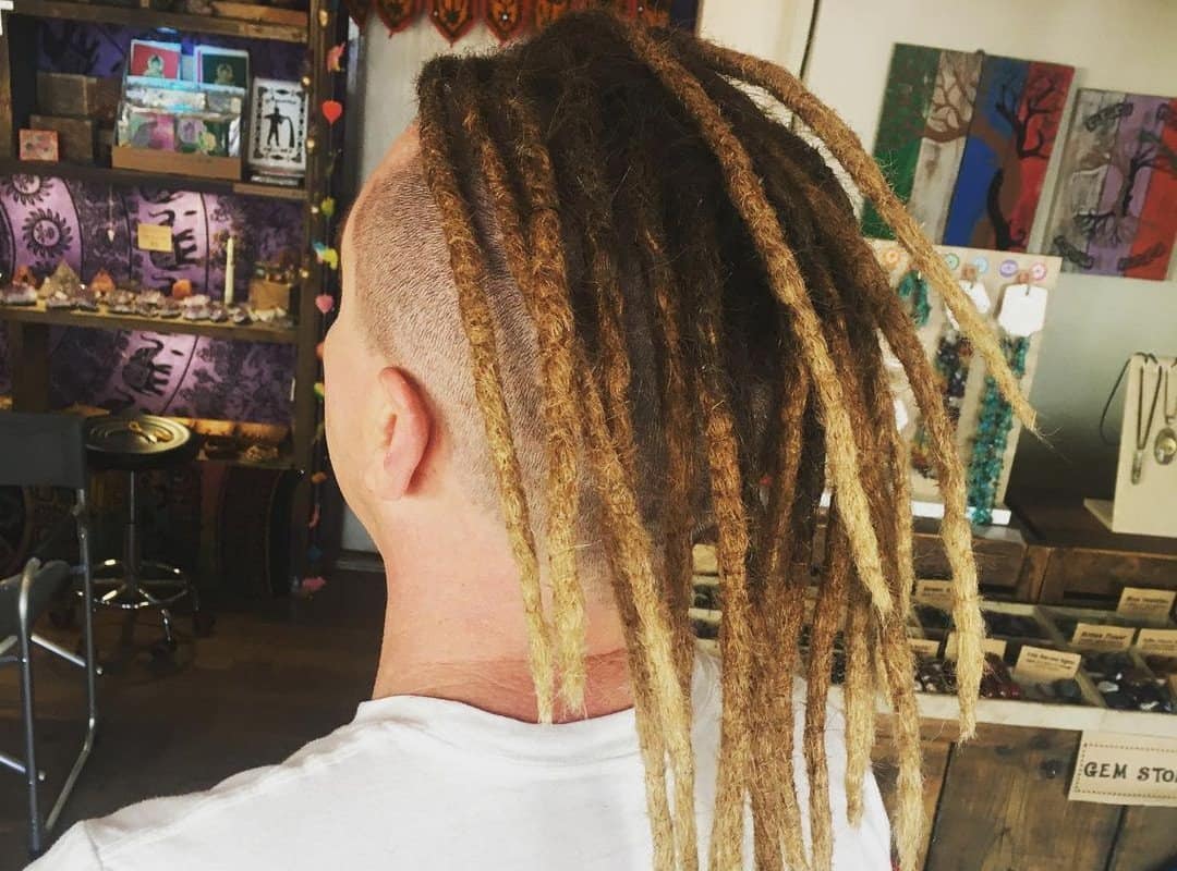 man with blonde and brown dyed dreads