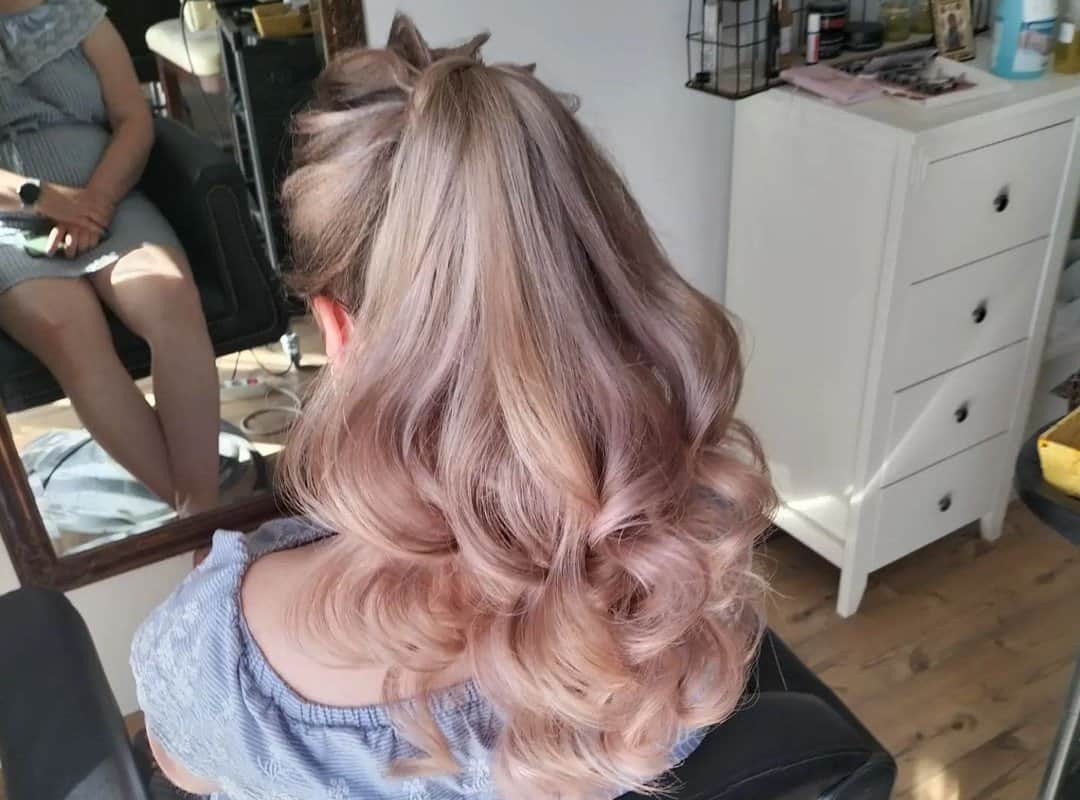 girl with blonde and pink curly high ponytail