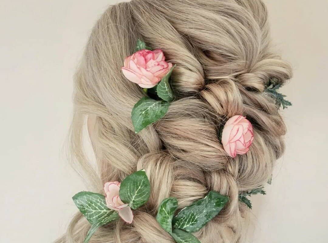 girl with blonde side swept with flowers