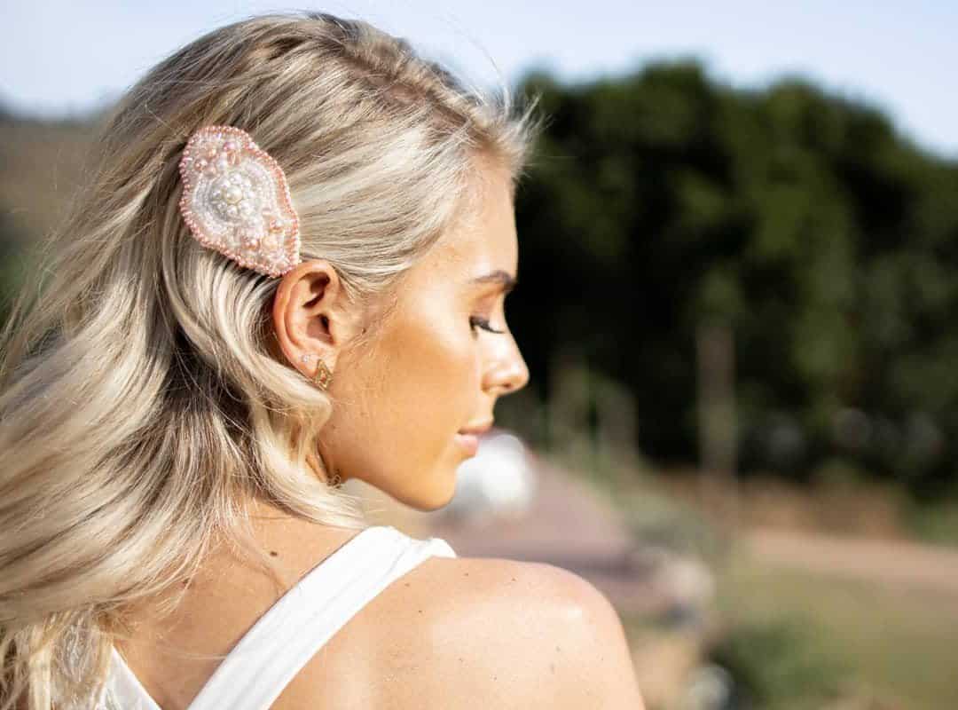 girl with blonde side swept with jewel