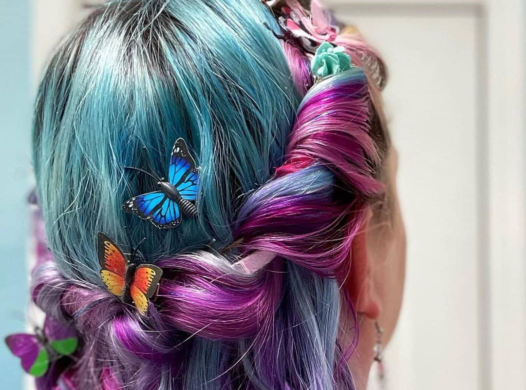 girl with blue and purple braided crown with butterfly