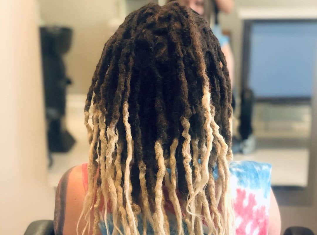 girl with brown and blonde dyed dreads