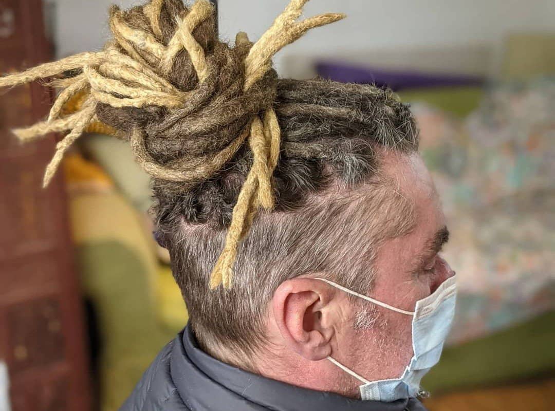 man with brown and blonde gradient dyed dreads