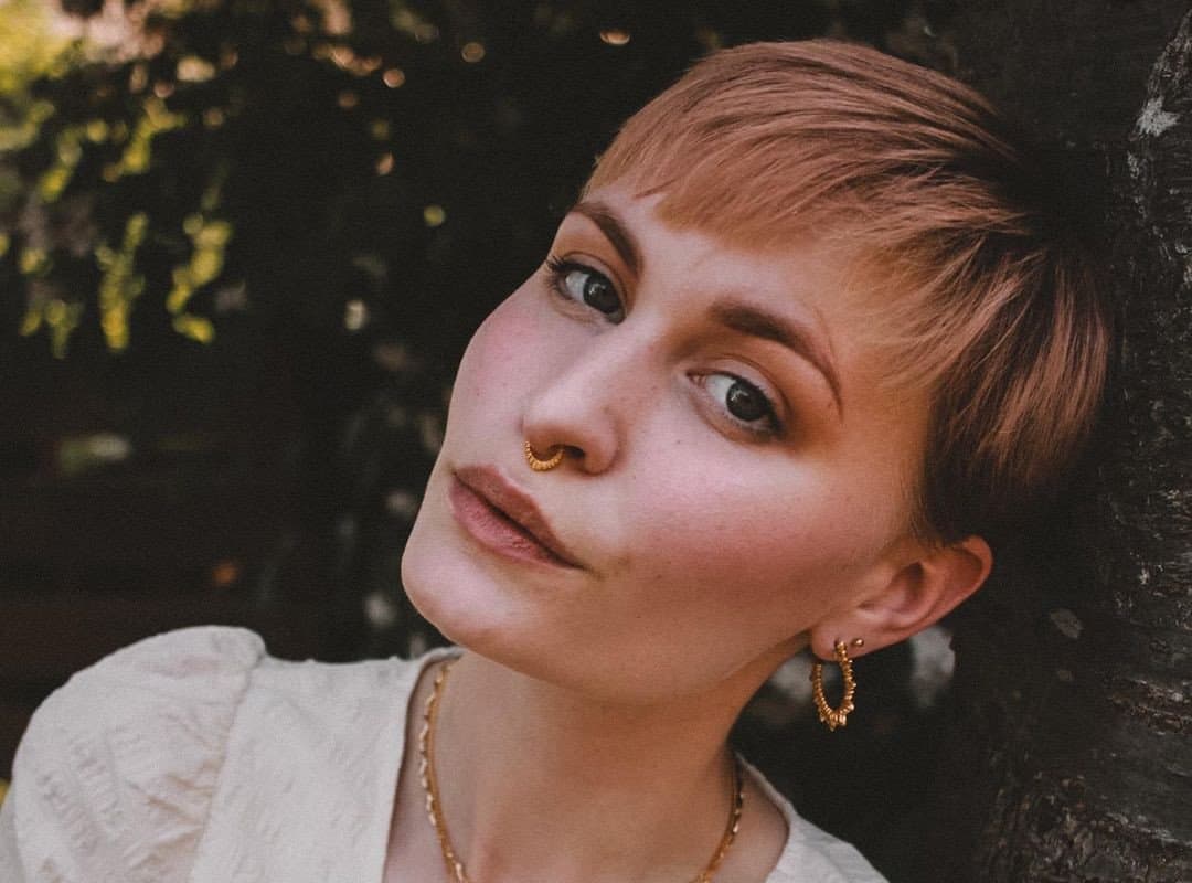 woman with brown and red pixie cut aesthetic