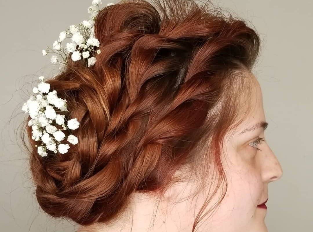 girl with brown and red updo with flowers