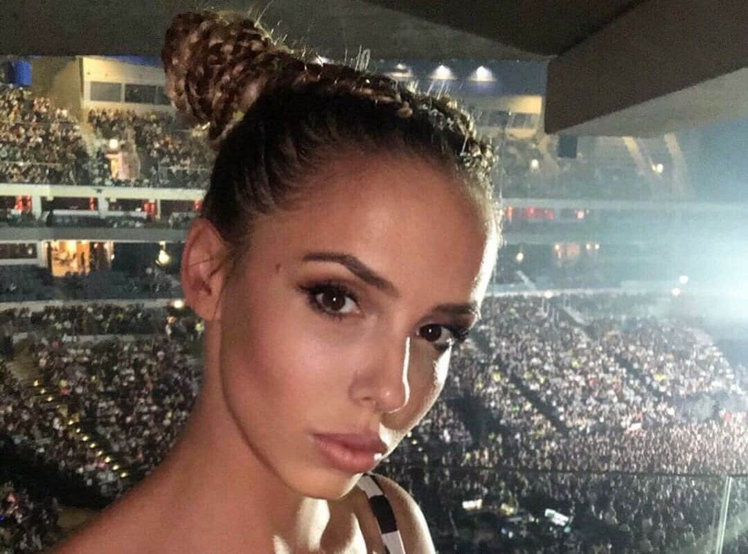 girl with brown braided buns