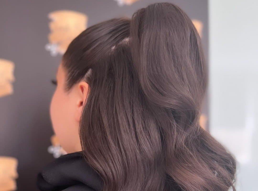 girl with a brown cheer half up, half down hairstyle