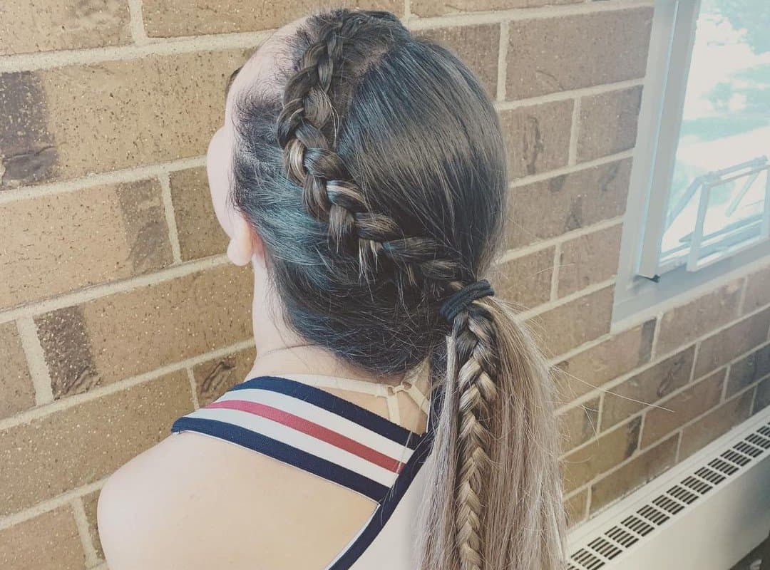 girl with a brown braided cheer ponytail