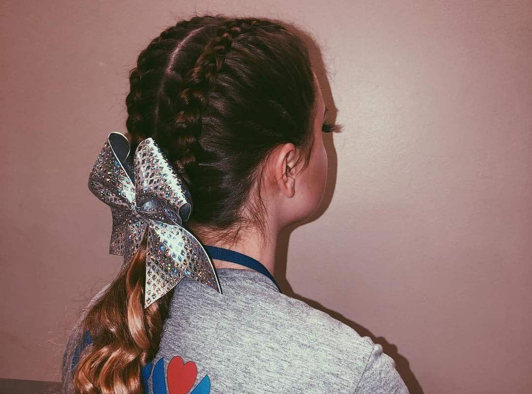girl with a brown cheer side braids