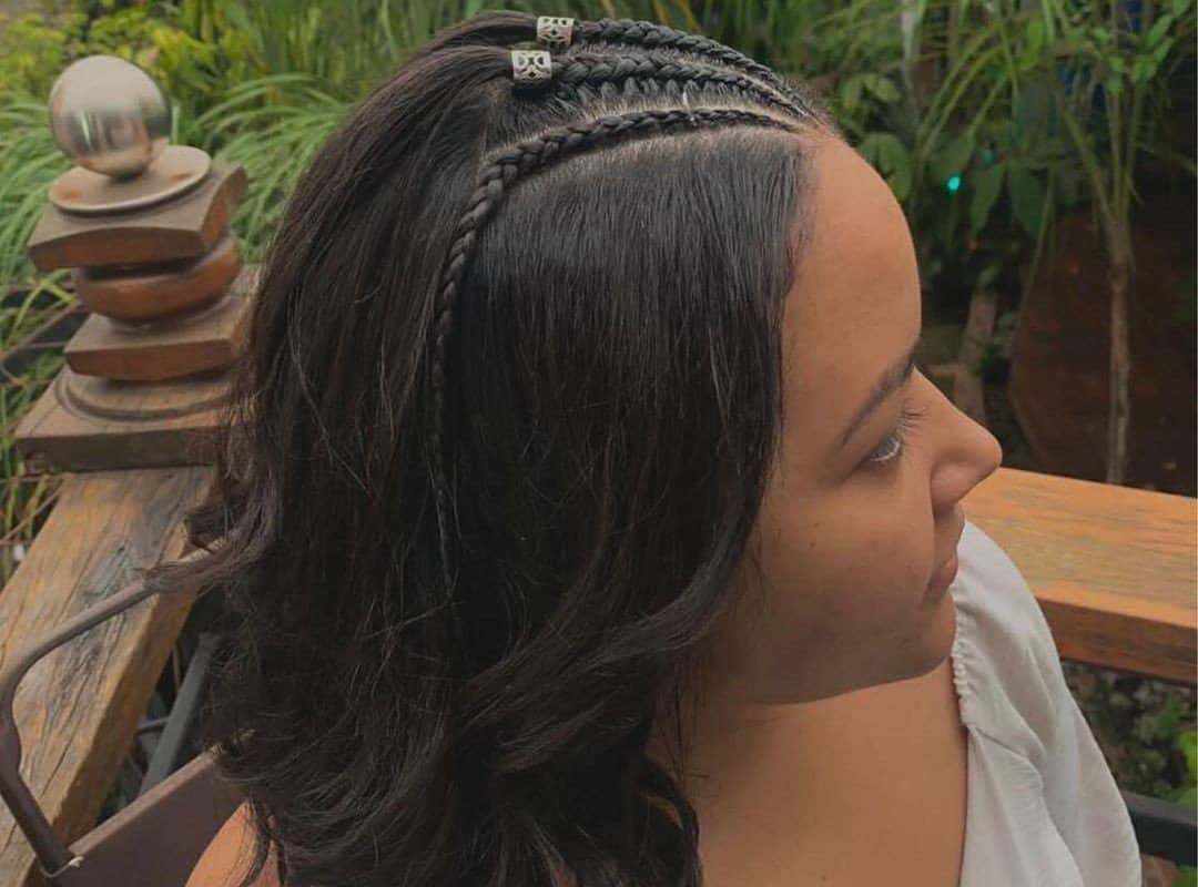 girl with brown curly stitch braids