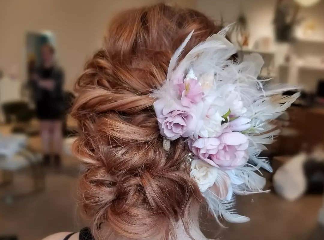 girl with brown half updo with flowers