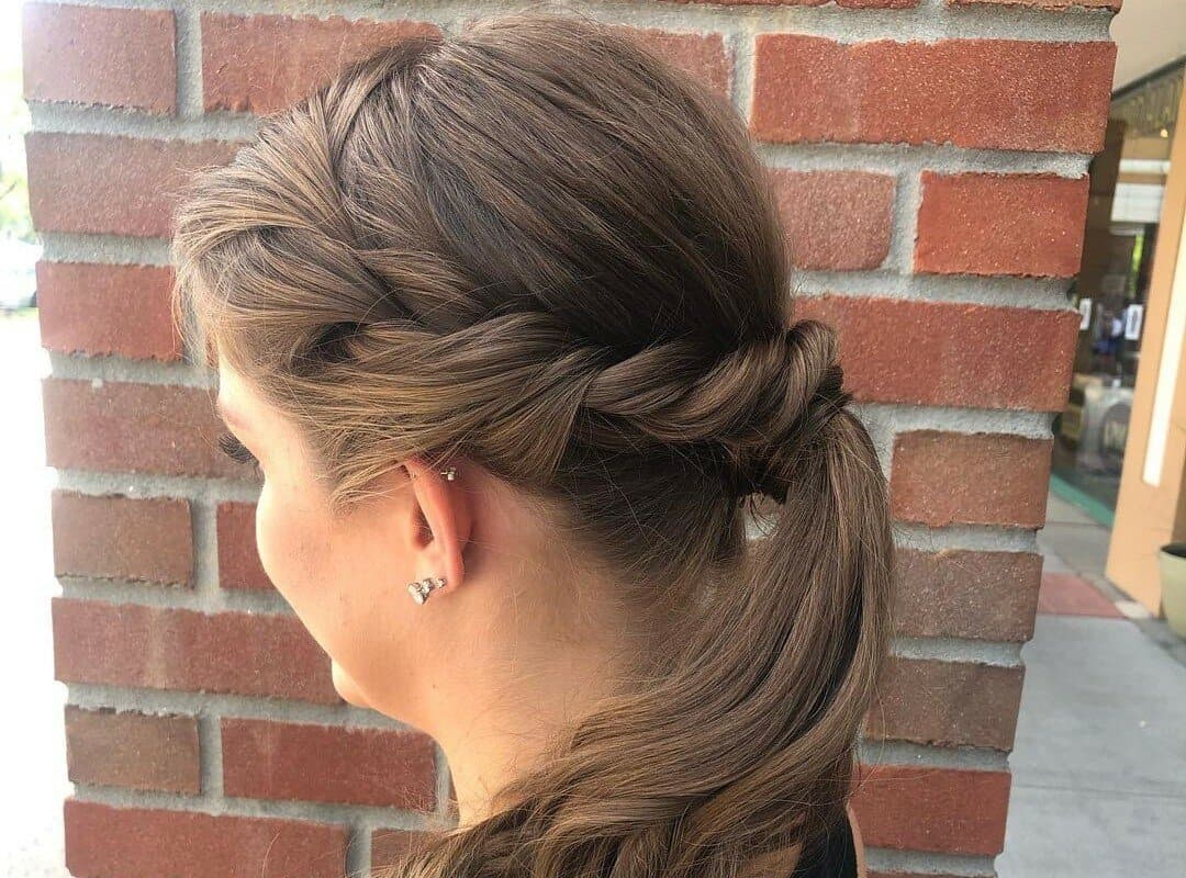 girl with brown high ponytail with a twist